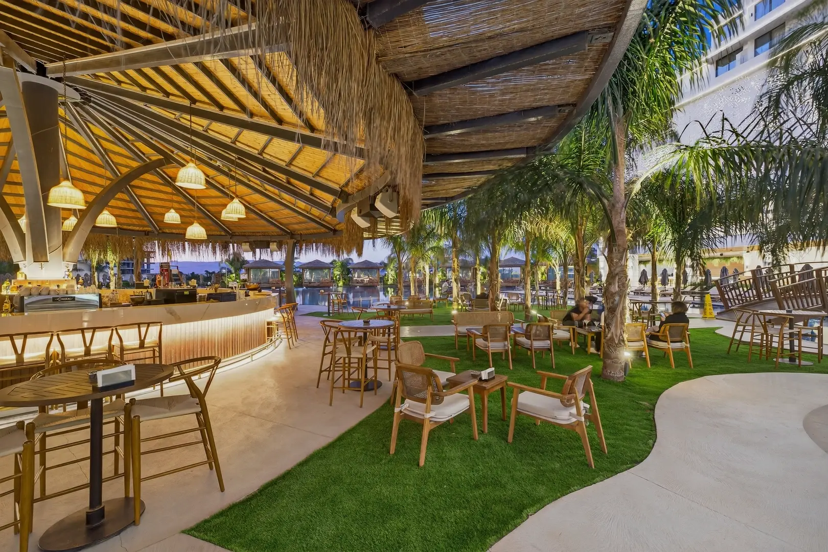 The resort's covered pool bar at dusk