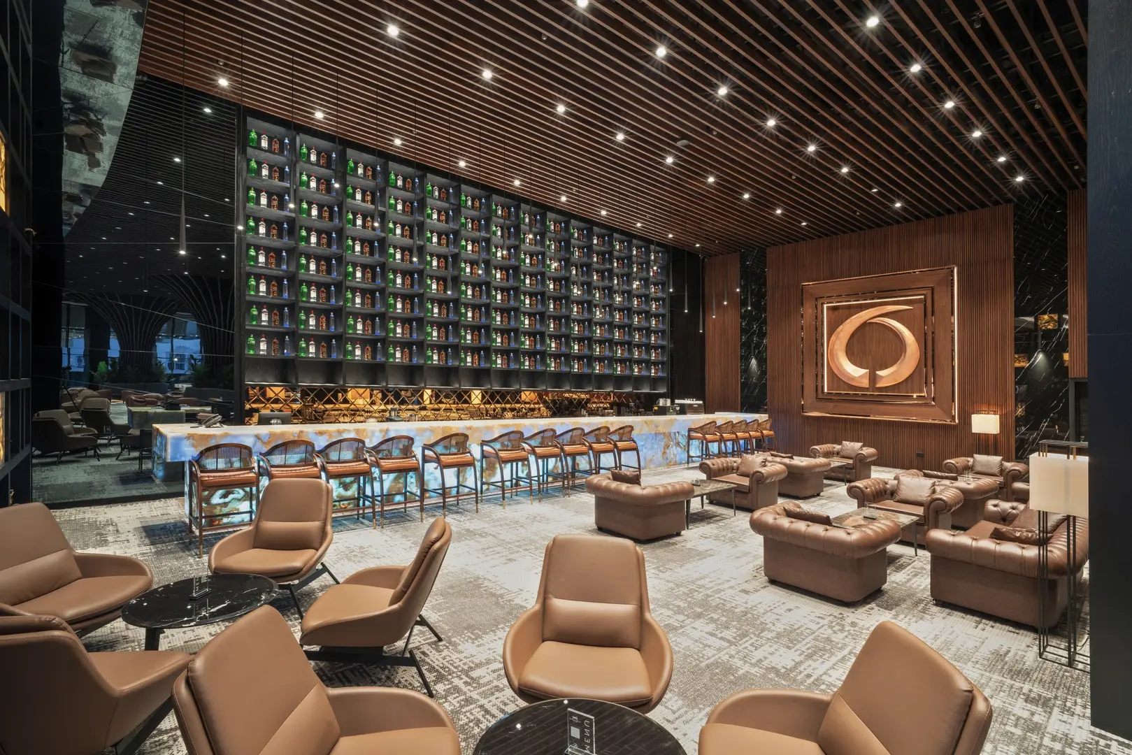 Lobby lounge with an illuminated bar wall