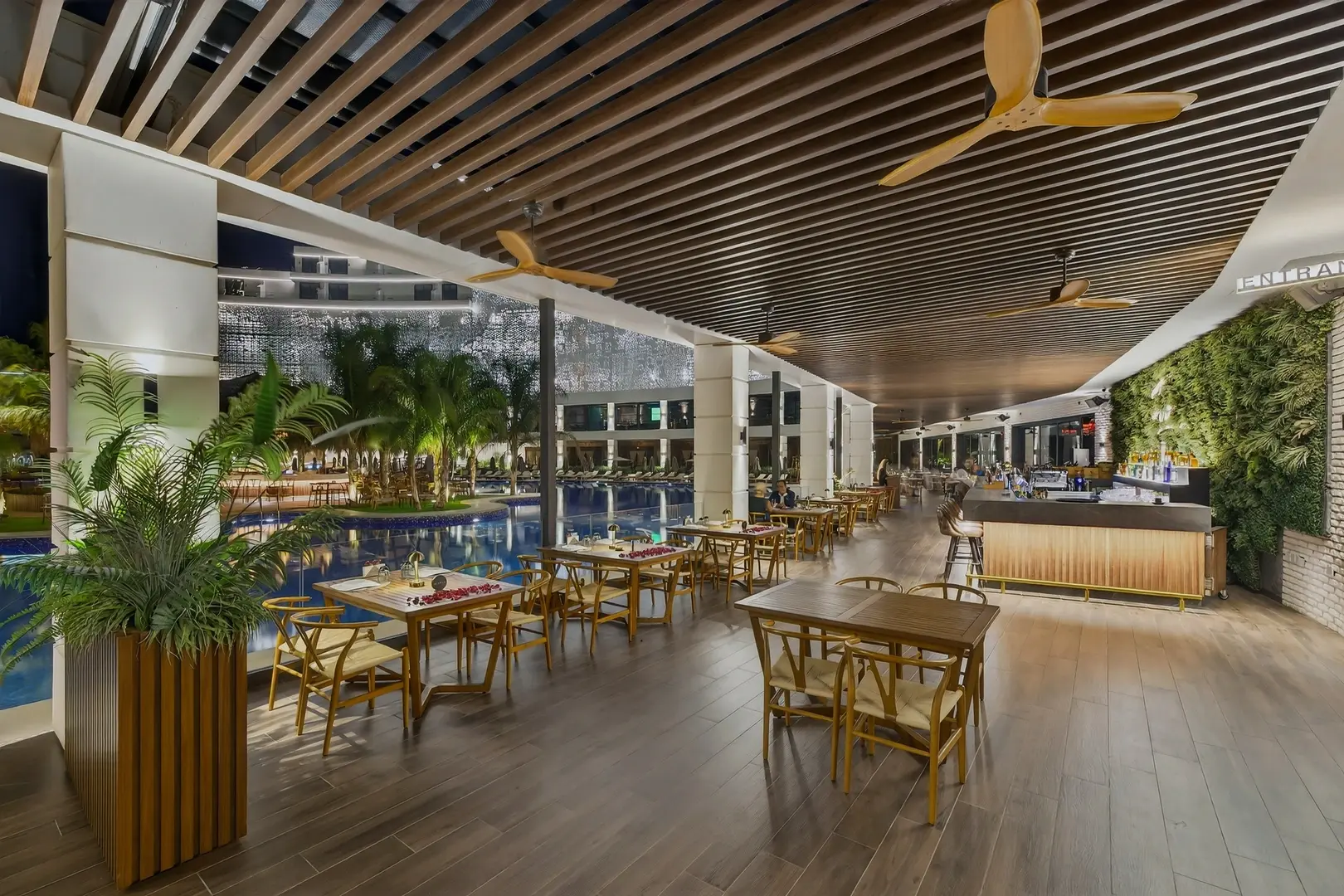 Restaurant interior with appetizers and wine at night