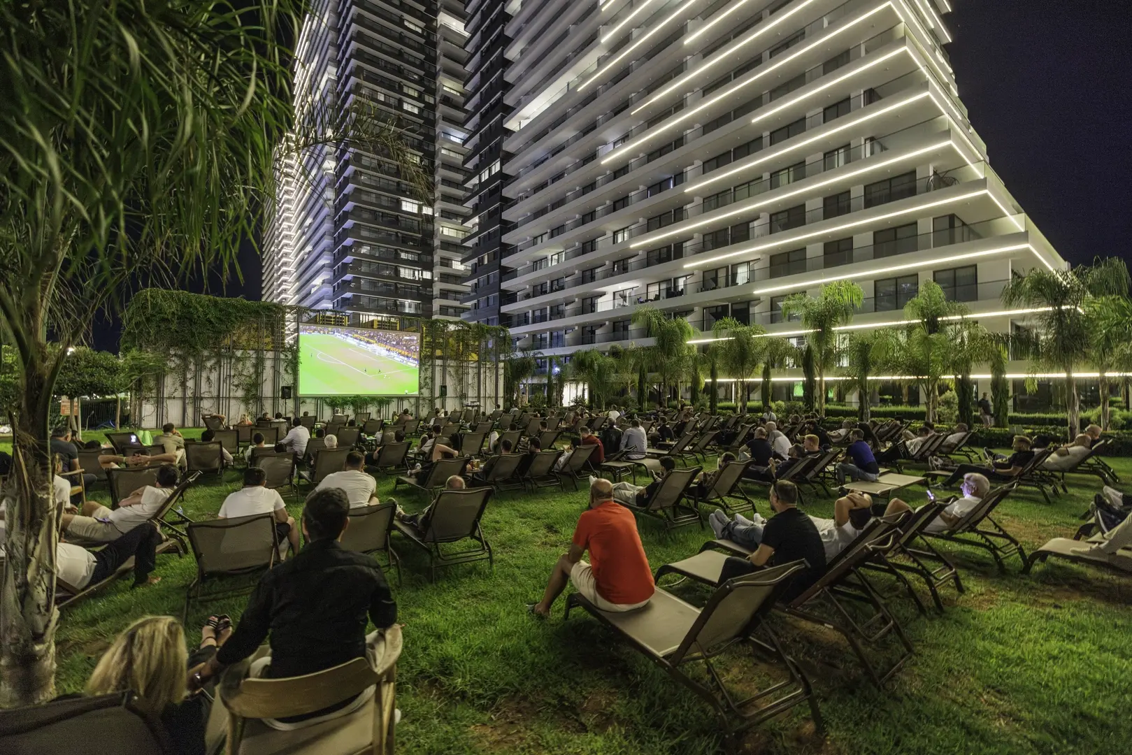 Open-air cinema on the resort's lawn in the evening