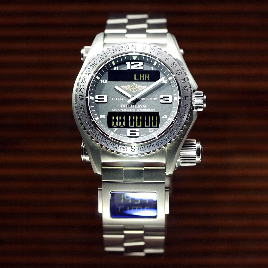 Breitling wristwatch with digital display on a dark background